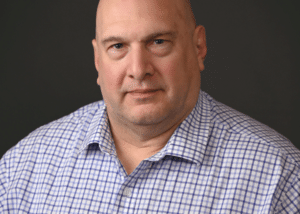 Headshot of Greg Musci, the Director of Finance