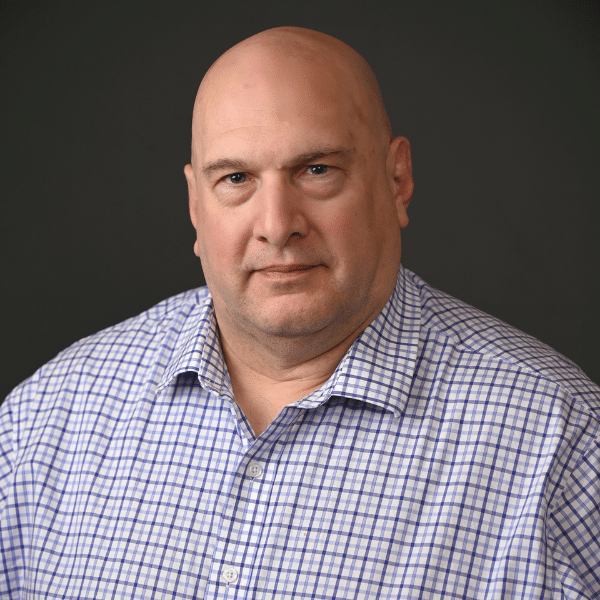 Headshot of Greg Musci, the Director of Finance