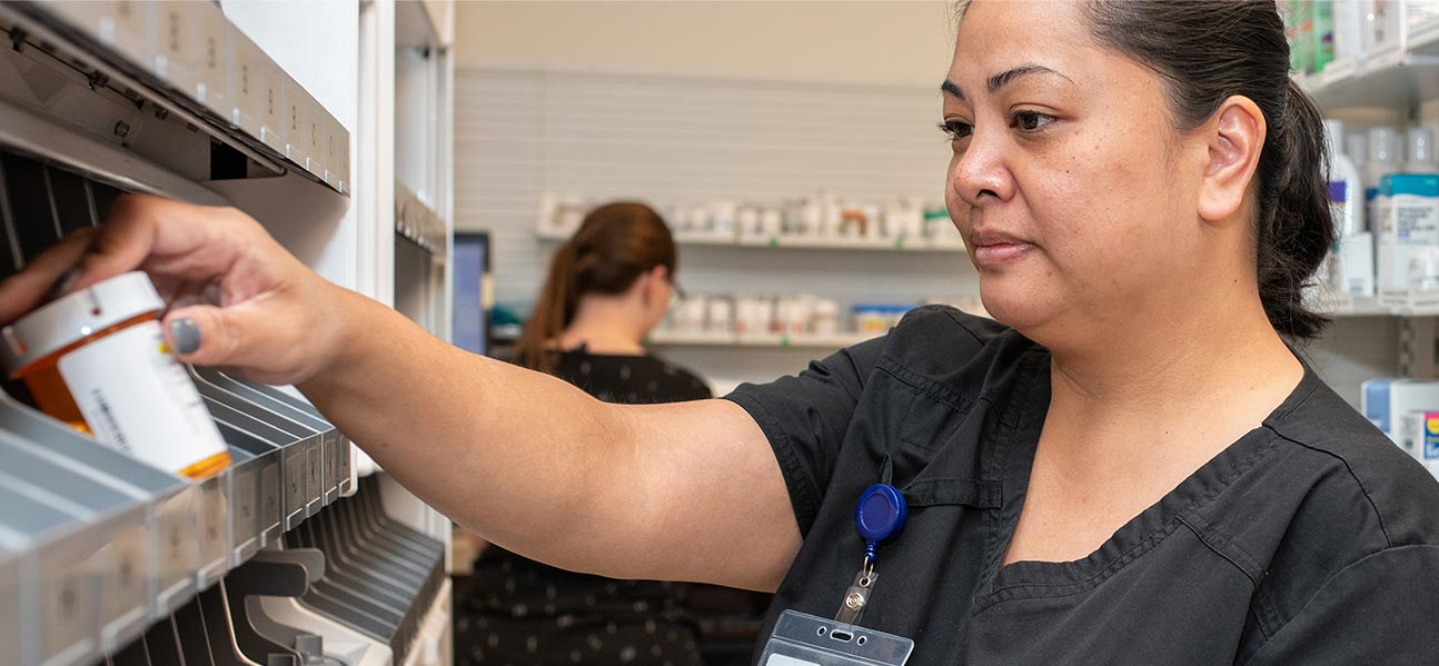 affordable-health-care woman at pharmacy helping find a doctor near me